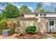 Charming townhouse featuring a landscaped yard and a neutral color palette, offering a welcoming curb appeal at 7900 Horse Chestnut Ln, Charlotte, NC 28277