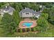 Aerial view of estate home with a large in-ground pool and meticulously landscaped grounds at 8800 Covey Rise Ct, Charlotte, NC 28226