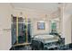 An elegant bathroom with green marble, a glass shower, and a soaking tub at 8800 Covey Rise Ct, Charlotte, NC 28226