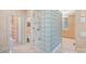 Bathroom with a walk-in shower, tile floors, built in storage, and separate toilet at 8800 Covey Rise Ct, Charlotte, NC 28226