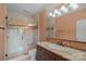 Bathroom with a frameless glass shower, granite vanity, and stylish fixtures at 8800 Covey Rise Ct, Charlotte, NC 28226