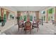 Formal dining room featuring a round table, elegant chairs, and ample natural light at 8800 Covey Rise Ct, Charlotte, NC 28226