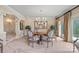 Elegant dining room with large round table, detailed chairs, and a decorative chandelier at 8800 Covey Rise Ct, Charlotte, NC 28226