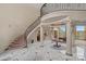 Elegant foyer with marble floors, soaring ceilings, curved staircase, and chandelier at 8800 Covey Rise Ct, Charlotte, NC 28226