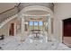 Stately foyer with marble floors, columns, and a grand staircase leading to the upper level at 8800 Covey Rise Ct, Charlotte, NC 28226