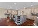 A kitchen with a large island, a butler's pantry, modern appliances, hardwood floors, and lots of storage at 8800 Covey Rise Ct, Charlotte, NC 28226