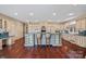Spacious kitchen with a large island, modern appliances, hardwood floors, and lots of counter space at 8800 Covey Rise Ct, Charlotte, NC 28226