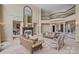 Spacious living room with fireplace, balcony access, and elegant seating arrangements at 8800 Covey Rise Ct, Charlotte, NC 28226