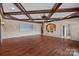 Large living area featuring wood floors, recessed lighting, and projector setup at 8800 Covey Rise Ct, Charlotte, NC 28226