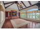 Living room with hardwood floors, a chandelier, built in storage, lots of natural light, and a lake view at 8800 Covey Rise Ct, Charlotte, NC 28226