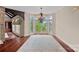 Living room with hardwood floors, a chandelier, lots of natural light, and a view of the lake at 8800 Covey Rise Ct, Charlotte, NC 28226