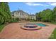 Beautiful backyard pool and spa area with expansive patio space at 8800 Covey Rise Ct, Charlotte, NC 28226