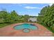 Lovely backyard pool and spa with an incredible lake view at 8800 Covey Rise Ct, Charlotte, NC 28226