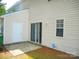 Rear exterior of house, patio, and yard with ADT security sign at 9139 Charminster Ct, Charlotte, NC 28269