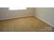 Bedroom featuring neutral walls, window, and carpeted flooring at 9139 Charminster Ct, Charlotte, NC 28269