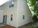 Exterior view of home showing siding, windows and sliding glass door at 9139 Charminster Ct, Charlotte, NC 28269