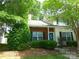 Charming townhouse with a brick facade, well-manicured shrubs, and inviting curb appeal at 9139 Charminster Ct, Charlotte, NC 28269