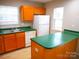Efficient kitchen with laminate counters, white appliances, and ample storage at 9139 Charminster Ct, Charlotte, NC 28269
