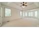 Spacious bedroom with abundant natural light from multiple windows and tray ceiling at 9202 Arlington Hills Dr, Mint Hill, NC 28227