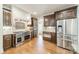 Gourmet kitchen featuring stainless steel appliances, custom cabinetry, and designer backsplash at 9202 Arlington Hills Dr, Mint Hill, NC 28227