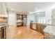 Modern kitchen with stainless steel appliances, granite countertops, and breakfast bar overlooking seating area at 9202 Arlington Hills Dr, Mint Hill, NC 28227