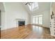 Bright living room with a vaulted ceiling, natural light, and a modern fireplace at 9202 Arlington Hills Dr, Mint Hill, NC 28227