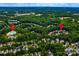 Aerial view showcasing a residential area near the Riverbend Swim Club, surrounded by mature tree coverage at 9410 Greenbank Ct, Charlotte, NC 28214