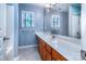 Bathroom features a large vanity with sink and a window at 9410 Greenbank Ct, Charlotte, NC 28214