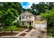Charming two-story home with a well-manicured lawn, a two-car garage, and a welcoming entrance at 9410 Greenbank Ct, Charlotte, NC 28214