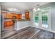 Open concept kitchen and dining area with access to a deck and stainless appliances at 9410 Greenbank Ct, Charlotte, NC 28214