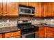 Modern kitchen with stainless steel appliances and granite countertops at 9410 Greenbank Ct, Charlotte, NC 28214