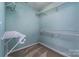 Walk-in closet with wire shelving provides ample storage at 9410 Greenbank Ct, Charlotte, NC 28214