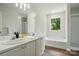 Bathroom with double sink vanity, soaking tub, and a separate glass-enclosed shower at 1005 Exodus Ct, Monroe, NC 28110