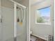 Bright bathroom features a walk-in shower and a window for natural light at 1005 Exodus Ct, Monroe, NC 28110