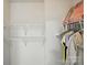 This is a walk-in closet with wire shelving and clothes hanging on the rack at 1005 Exodus Ct, Monroe, NC 28110