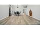 Open floor plan showcases dining area, hardwood floors and a custom-built dog house in the corner at 1005 Exodus Ct, Monroe, NC 28110