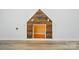 Built-in dog house features a rustic wood design, interior lighting, and cozy space for a furry friend at 1005 Exodus Ct, Monroe, NC 28110
