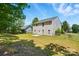 A two-story home exterior featuring a well-maintained backyard with a wooden fence at 1005 Exodus Ct, Monroe, NC 28110