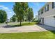View of the property's manicured front lawn and driveway leading to the attached garage, showcasing its curb appeal at 1005 Exodus Ct, Monroe, NC 28110