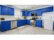 Bright kitchen with blue cabinets, marble countertops, stainless steel appliances, and modern backsplash at 1005 Exodus Ct, Monroe, NC 28110