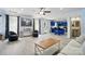 Bright and open living area with modern flooring, stylish furniture, and a glimpse of the kitchen at 1005 Exodus Ct, Monroe, NC 28110