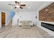 Cozy living room featuring durable floors, recessed lighting, and wood-burning fireplace for comfort at 1005 Exodus Ct, Monroe, NC 28110