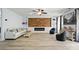 Modern living area with hardwood flooring, wood accent wall, fireplace, and stylish decor at 1005 Exodus Ct, Monroe, NC 28110