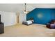 Spacious main bedroom featuring a vaulted ceiling and a calming blue accent wall at 1005 Exodus Ct, Monroe, NC 28110