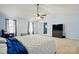 Large primary bedroom with vaulted ceiling, plush carpet, ample natural light, and a ceiling fan at 1005 Exodus Ct, Monroe, NC 28110