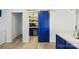 Pantry with shelves, beverage fridge and modern sliding barn door at 1005 Exodus Ct, Monroe, NC 28110