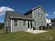 Exterior backyard featuring a home with a patio, well-kept lawn, and privacy fence at 1016 Laggan Ln, Indian Trail, NC 28079
