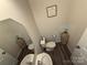 Modern half-bathroom featuring a mirror, vanity, and contemporary fixtures at 1016 Laggan Ln, Indian Trail, NC 28079