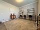 A room featuring stylish wallpaper, two desks, and a cozy rug, creating a functional workspace at 1016 Laggan Ln, Indian Trail, NC 28079