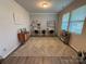 A room featuring stylish wallpaper, two desks, and a cozy rug, creating a functional workspace at 1016 Laggan Ln, Indian Trail, NC 28079